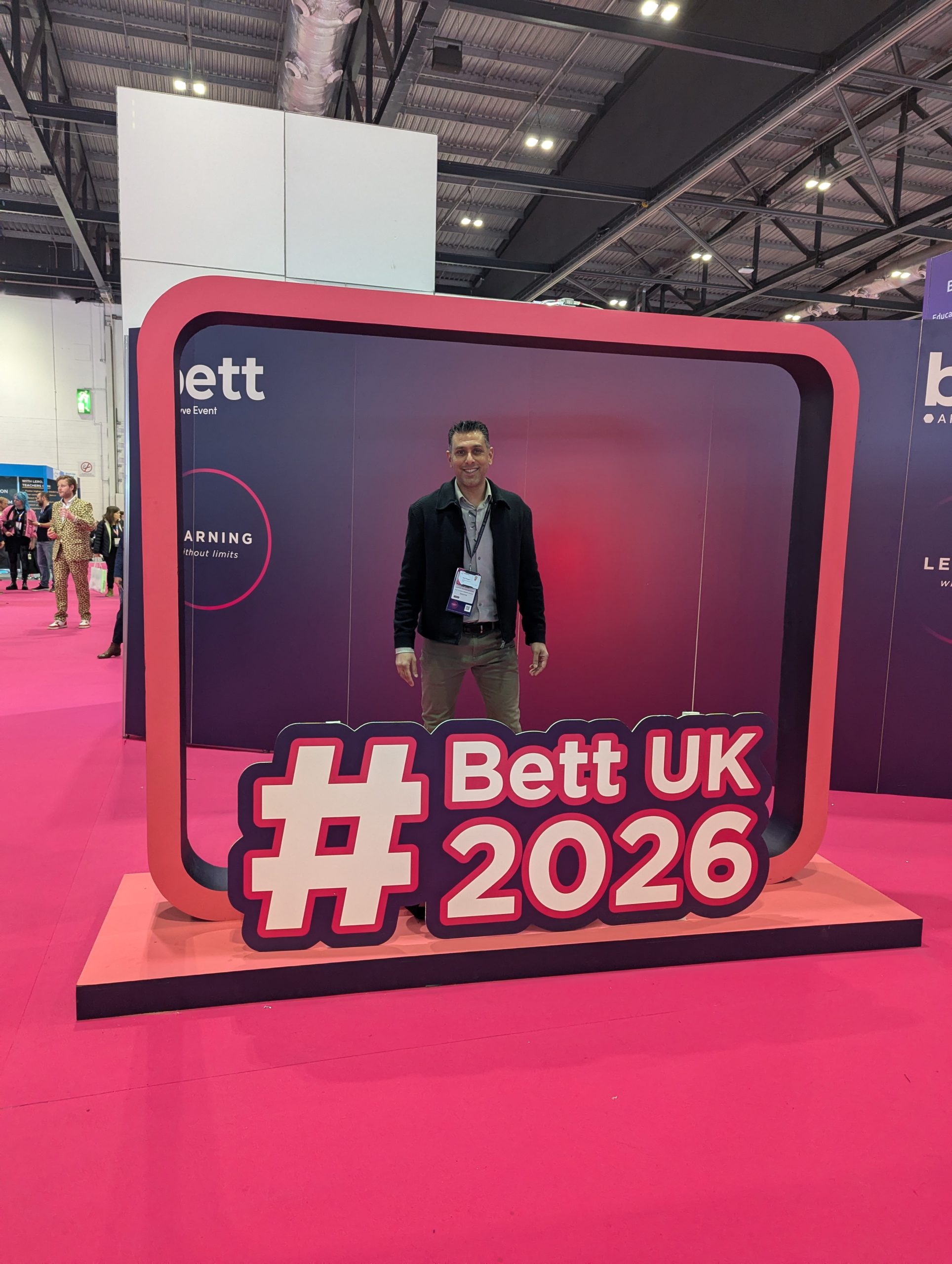 Ravi Chagger beside the main sign at the Bett Show